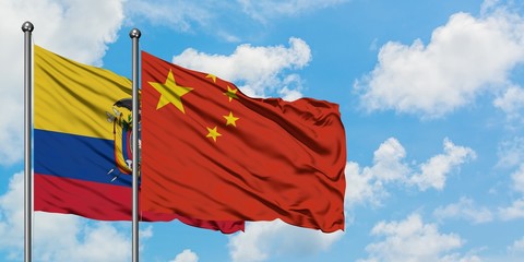 Ecuador and China flag waving in the wind against white cloudy blue sky together. Diplomacy concept, international relations.