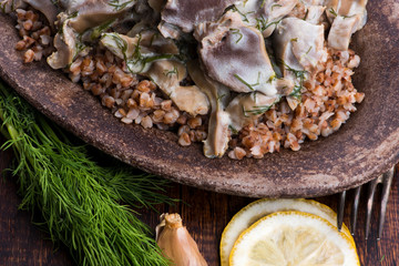 Stewed turkey stomachs with vegetables and buckwheat in a bowl
