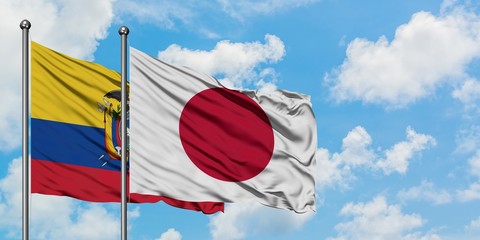 Ecuador and Japan flag waving in the wind against white cloudy blue sky together. Diplomacy concept, international relations.