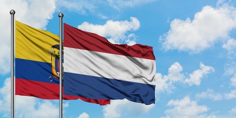 Ecuador and Netherlands flag waving in the wind against white cloudy blue sky together. Diplomacy concept, international relations.