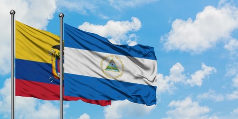 Ecuador and Nicaragua flag waving in the wind against white cloudy blue sky together. Diplomacy concept, international relations.