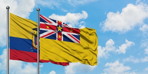 Ecuador and Niue flag waving in the wind against white cloudy blue sky together. Diplomacy concept, international relations.