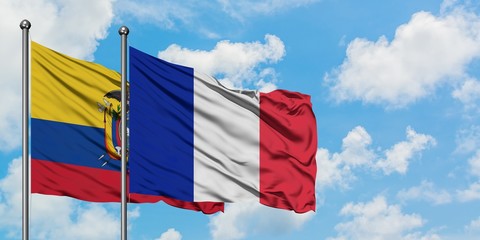 Ecuador and Reunion flag waving in the wind against white cloudy blue sky together. Diplomacy concept, international relations.