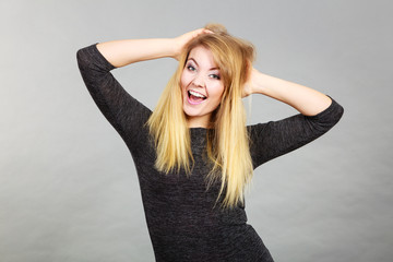 Fototapeta premium Portrait of happy blonde woman smiling with joy