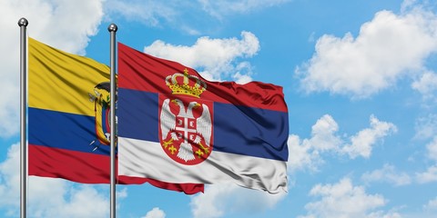Ecuador and Serbia flag waving in the wind against white cloudy blue sky together. Diplomacy concept, international relations.