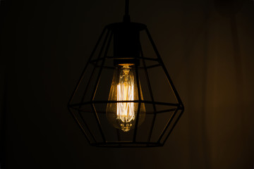 Lamp with threads in the black frame of the lamp