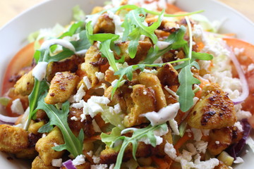 Delicious chicken salad in a white plate.
