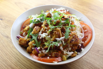 Delicious chicken salad in a white plate.