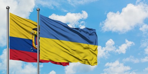 Ecuador and Ukraine flag waving in the wind against white cloudy blue sky together. Diplomacy concept, international relations.