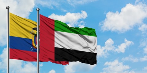 Ecuador and United Arab Emirates flag waving in the wind against white cloudy blue sky together. Diplomacy concept, international relations.