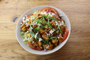 Delicious chicken salad in a white plate.