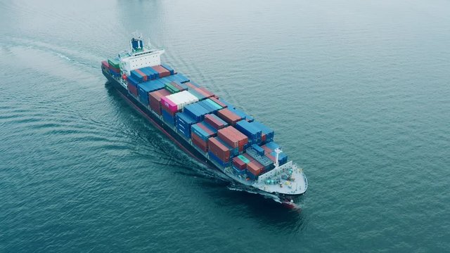 Aerial view of sea freight, Cargo ship, Cargo container in factory harbor at industrial estate for import export around in the world, Trade Port / Shipping - cargo to harbor