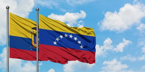 Ecuador and Venezuela flag waving in the wind against white cloudy blue sky together. Diplomacy concept, international relations.