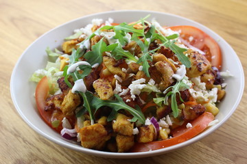 Delicious chicken salad in a white plate.