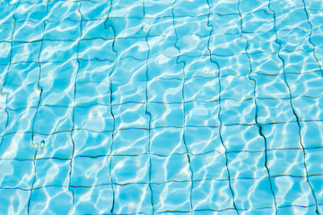 Water surface in blue swimming pool