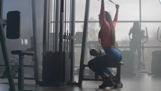 The woman at the morning workout in the gym