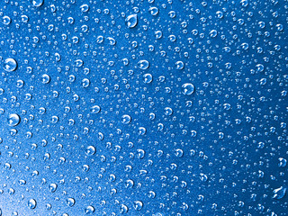 Water drop on blue