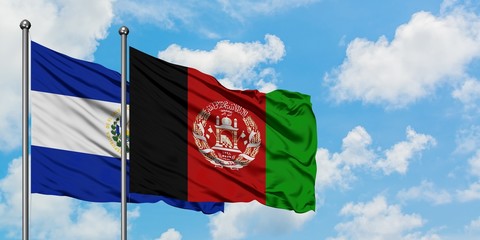 El Salvador and Afghanistan flag waving in the wind against white cloudy blue sky together. Diplomacy concept, international relations.