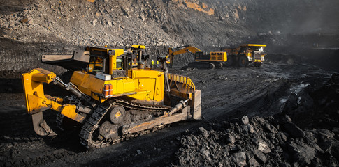 Open mine minerals coal. Workflow using transport, excavator, large dump truck. Level soil after...