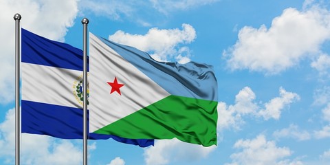 El Salvador and Djibouti flag waving in the wind against white cloudy blue sky together. Diplomacy concept, international relations.