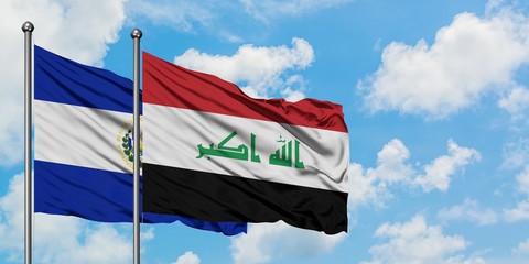 El Salvador and Iraq flag waving in the wind against white cloudy blue sky together. Diplomacy concept, international relations.