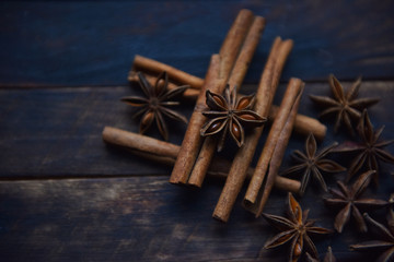 Cassia sticks and star anise on a brown background