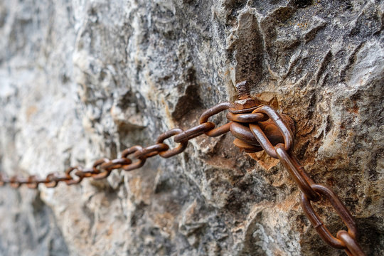 chain and chain fastening to a sheer rock to hold on during walks