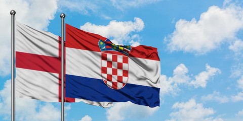 England and Croatia flag waving in the wind against white cloudy blue sky together. Diplomacy concept, international relations.