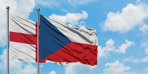 England and Czech Republic flag waving in the wind against white cloudy blue sky together. Diplomacy concept, international relations.