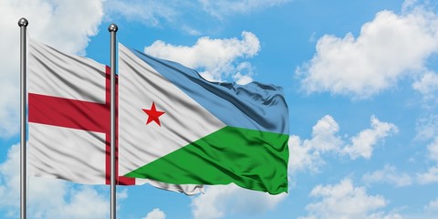 England and Djibouti flag waving in the wind against white cloudy blue sky together. Diplomacy concept, international relations.