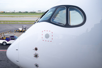 Cockpit view of modern airplane is parking at an airport before pilot and passenger come.