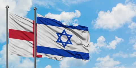 England and Israel flag waving in the wind against white cloudy blue sky together. Diplomacy concept, international relations.
