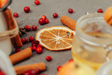 Berries and spices for mulled wine cooking close up on kitchen table