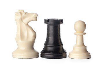 Black and white chess pieces on white background