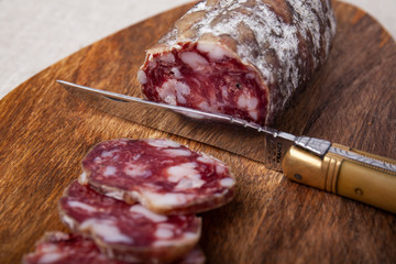 pork dry sausage on cutting board