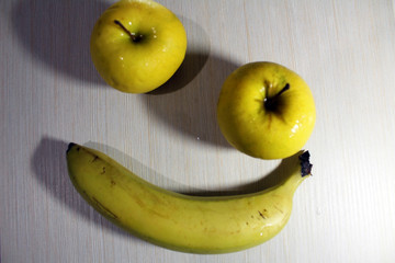 bananas and apple on white background