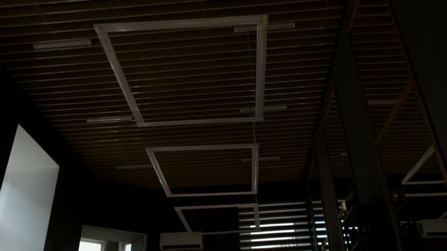 Decorations under the modern ceiling. Linear neon light bulb with background illumination. Modern lamp lighting under the ceiling. Interior ideas.