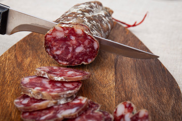 pork dry sausage on cutting board