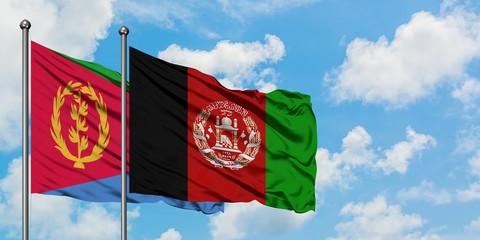 Eritrea and Afghanistan flag waving in the wind against white cloudy blue sky together. Diplomacy concept, international relations.