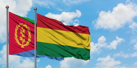 Eritrea and Bolivia flag waving in the wind against white cloudy blue sky together. Diplomacy concept, international relations.