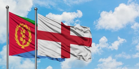 Eritrea and England flag waving in the wind against white cloudy blue sky together. Diplomacy concept, international relations.