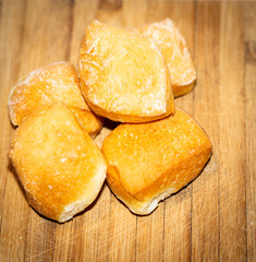 Bread rolls on a wooden cutting board