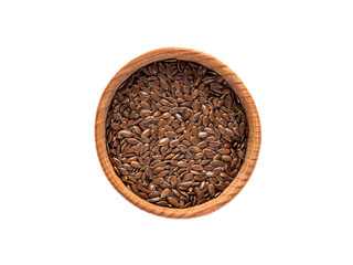 Linum seeds in a wooden Cup on a white background