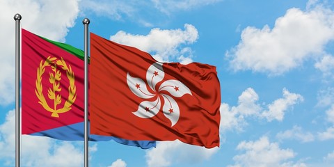 Eritrea and Hong Kong flag waving in the wind against white cloudy blue sky together. Diplomacy concept, international relations.