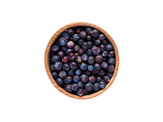 Juniperus fruit in wooden Cup on white background