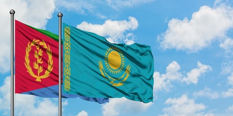 Eritrea and Kazakhstan flag waving in the wind against white cloudy blue sky together. Diplomacy concept, international relations.