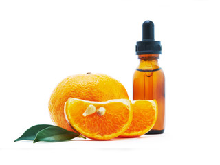 Oranges and bottle with essential oil, Vitamin serum in the bottle and Oranges on white background