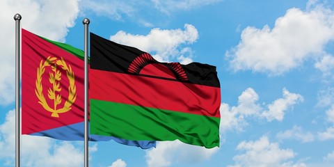 Eritrea and Malawi flag waving in the wind against white cloudy blue sky together. Diplomacy concept, international relations.