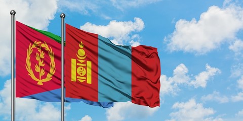 Eritrea and Mongolia flag waving in the wind against white cloudy blue sky together. Diplomacy concept, international relations.
