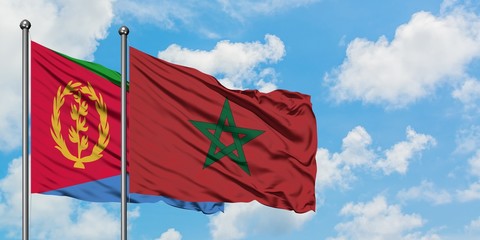 Eritrea and Morocco flag waving in the wind against white cloudy blue sky together. Diplomacy concept, international relations.